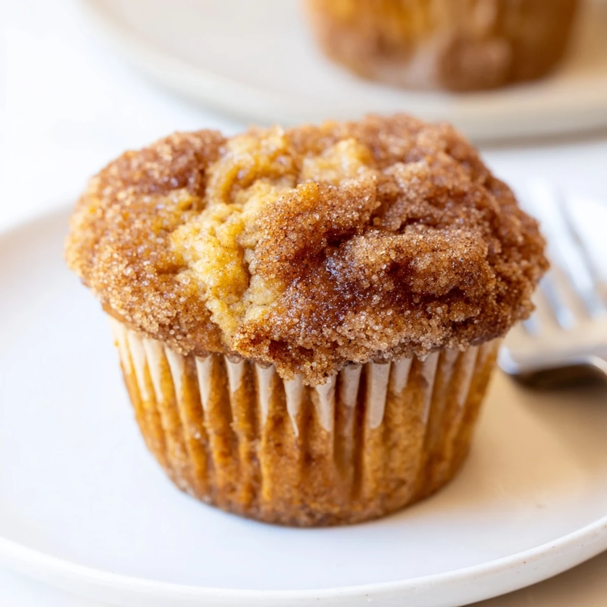 Flaky sweet potato biscuit muffins drizzled with maple syrup and cinnamon sugar topping.  
