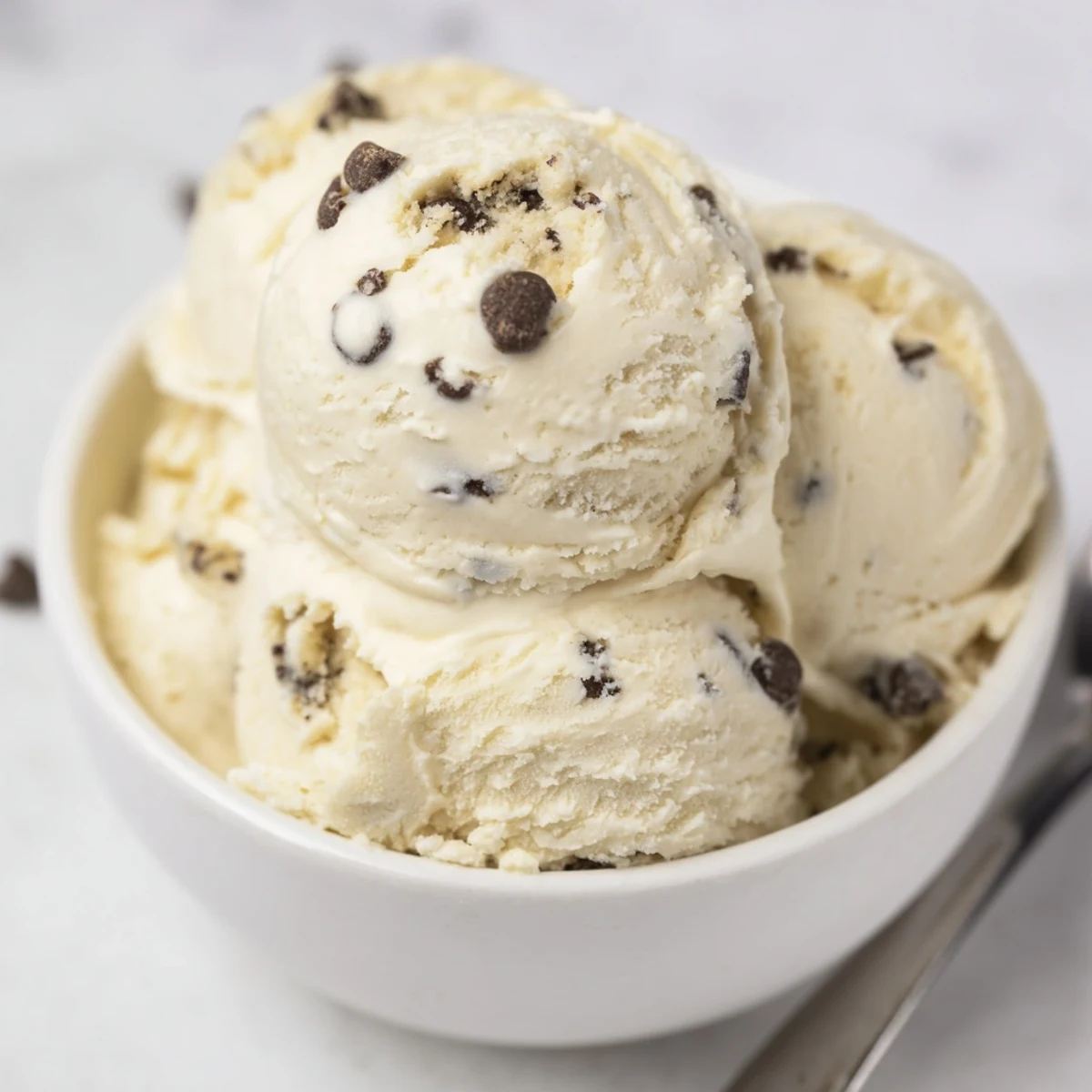 Whipped cottage cheese ice cream topped with rich chocolate chip cookie dough treats.