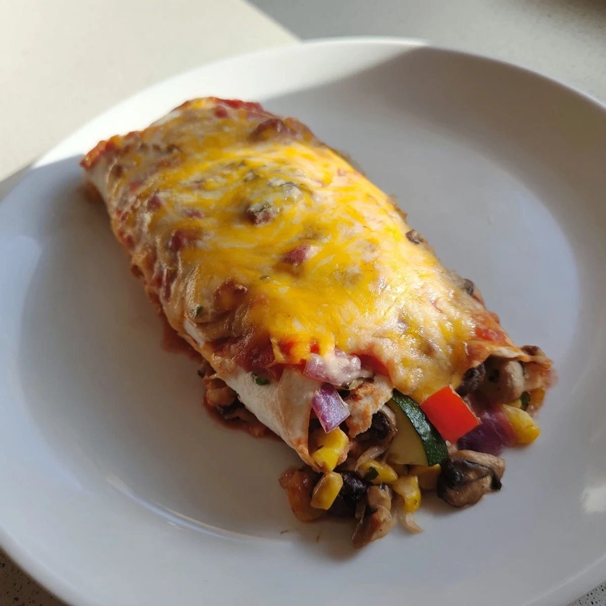 Farmers Market Vegetarian Enchiladas bubbling with cheese and a vibrant, flavorful vegetable filling; a perfect vegetarian dinner.