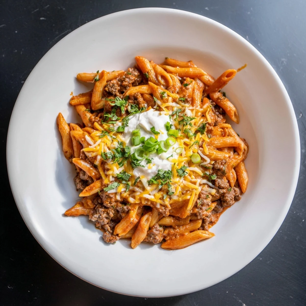 One-pot Easy Beef Enchilada Pasta, a melty, cheesy delight with savory ground beef and zesty flavors.