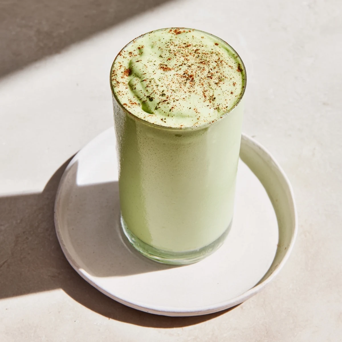 A creamy Matcha Snickerdoodle Protein Shake, a quick breakfast swirled with green and brown hues.