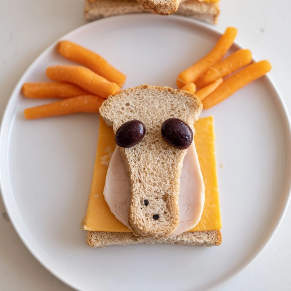These whimsical horse head sandwich cutouts feature cheese and meat, perfect for a themed lunchbox.