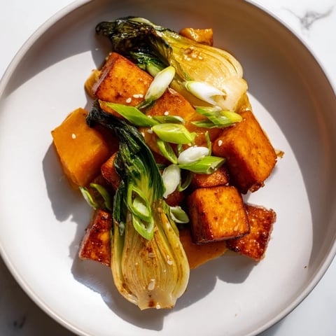 Golden-brown miso-glazed tofu and winter squash are beautifully arranged with bok choy.