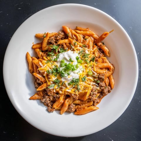 One-pot Easy Beef Enchilada Pasta, a melty, cheesy delight with savory ground beef and zesty flavors.