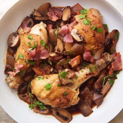 Tender Instant Pot Coq au Vin Style Chicken Thighs with a rich, red wine sauce and bacon.