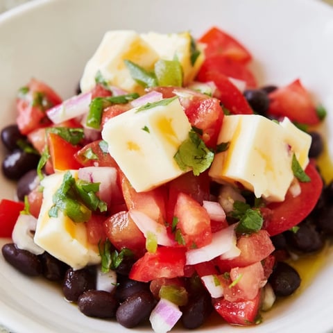 Freshly made Pepper Jack cheese cubes with vibrant black bean salsa, perfect for sharing.