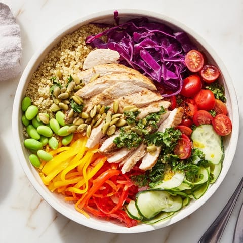 Vibrant healthy meal-prep bowls with layers of fresh veggies and zesty dressing.  