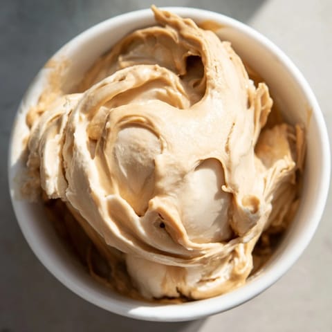 Frozen banana blended with peanut butter forms delicious Peanut Butter Banana Ice Cream, vegan and refreshing.