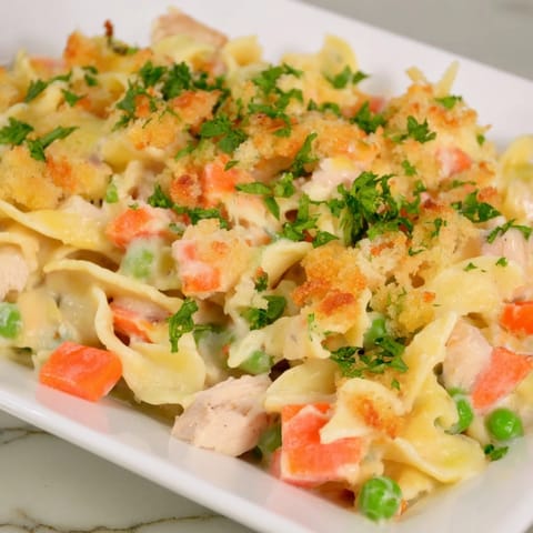 A close-up of a casserole dish showing a comforting Baked Cream of Chicken Noodle Soup Pasta, inviting and warm.