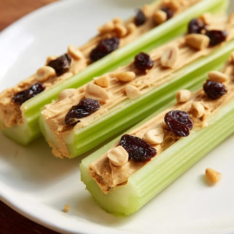 Cool, creamy peanut butter filling the celery's grooves in these delightful peanut butter celery sticks.