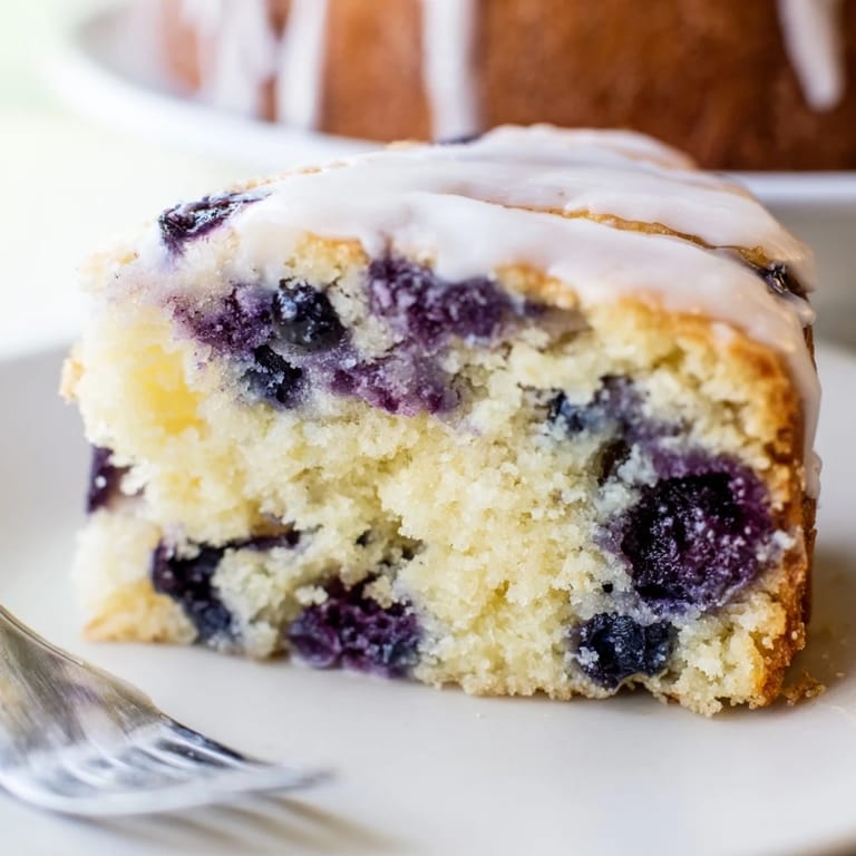 Moist sheet cake inspired by blueberry pancakes, perfect for breakfast gatherings.  