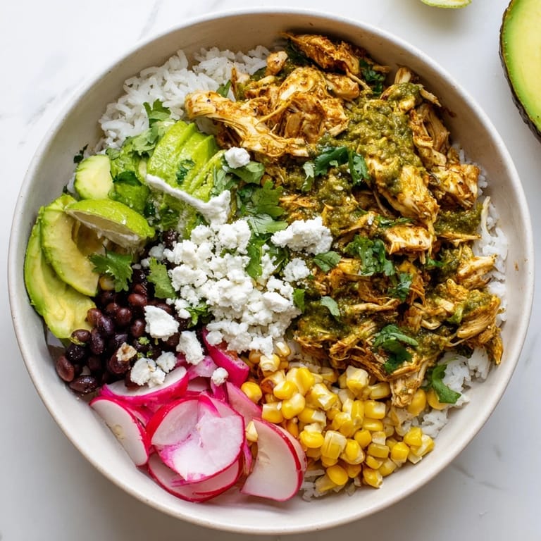 Colorful Green Enchiladas Rice Bowl featuring tender chicken, rice, and vibrant veggies.  